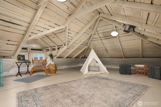 interior space featuring lofted ceiling with beams, hardwood / wood-style flooring, and wood ceiling