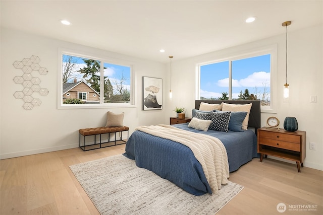 bedroom featuring recessed lighting, light wood-style floors, and baseboards