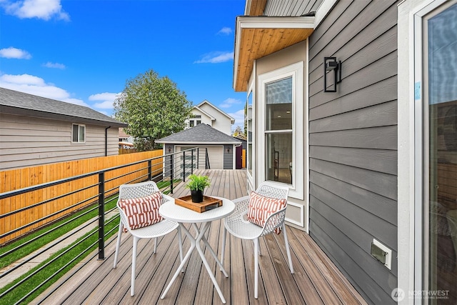 wooden deck featuring fence