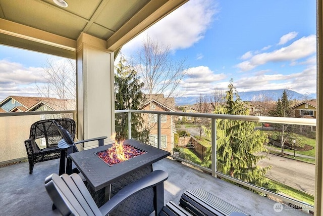 balcony with an outdoor fire pit