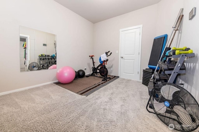 workout room featuring carpet flooring and baseboards