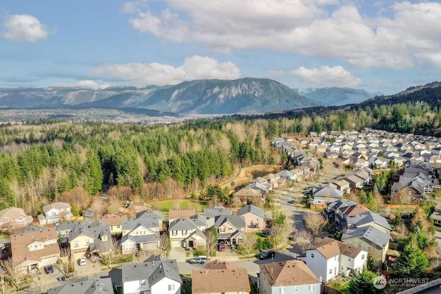 property view of mountains featuring a residential view and a wooded view