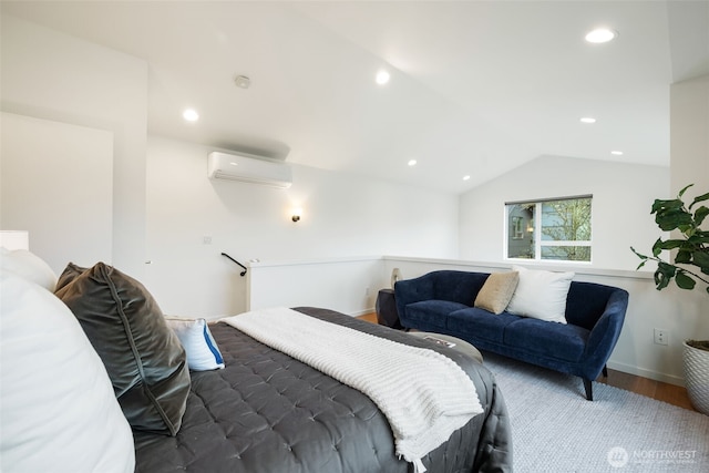 bedroom featuring recessed lighting, an AC wall unit, wood finished floors, and vaulted ceiling