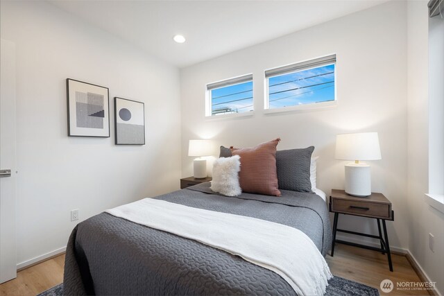 bedroom featuring recessed lighting, baseboards, and light wood finished floors