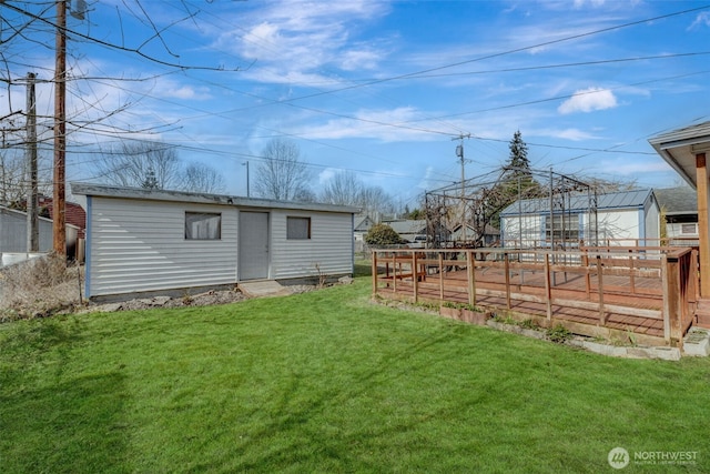 view of yard featuring an outdoor structure, a vegetable garden, and fence