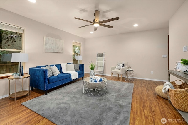 living room featuring recessed lighting, baseboards, ceiling fan, and wood finished floors