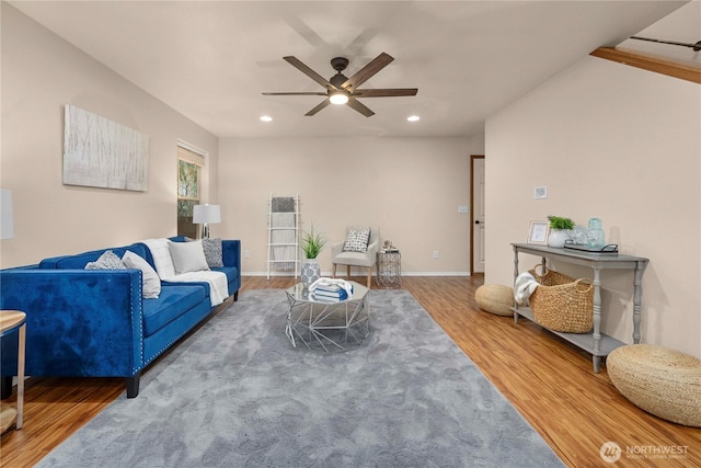 living room featuring recessed lighting, baseboards, a ceiling fan, and wood finished floors