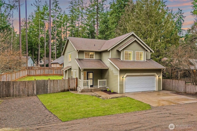 view of front of house featuring fence, an attached garage, a yard, a shingled roof, and concrete driveway