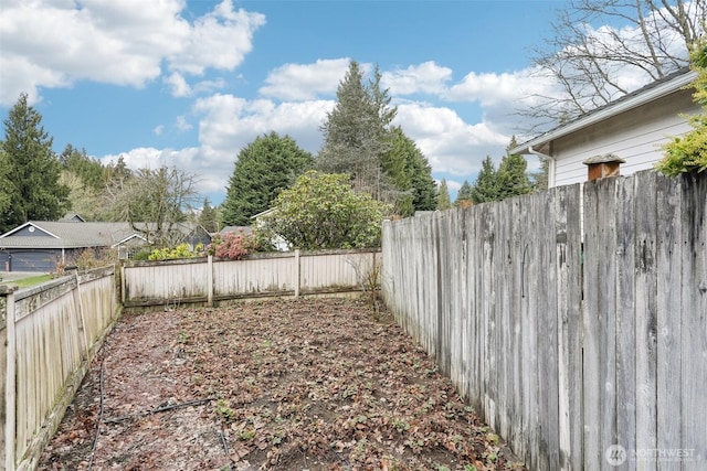 view of yard featuring a fenced backyard