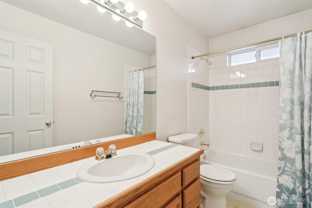 full bath featuring vanity, toilet, and shower / tub combo