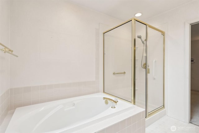 bathroom featuring recessed lighting, a garden tub, and a stall shower