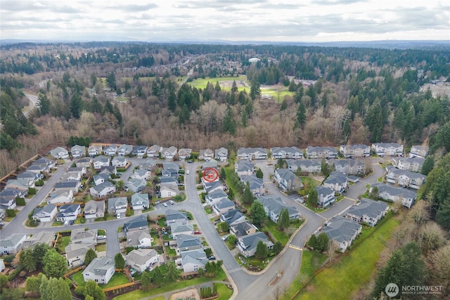 birds eye view of property with a residential view