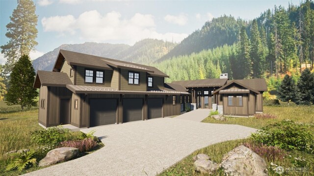 view of front of house featuring a mountain view, an attached garage, board and batten siding, and driveway