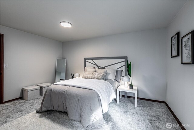 carpeted bedroom with baseboards