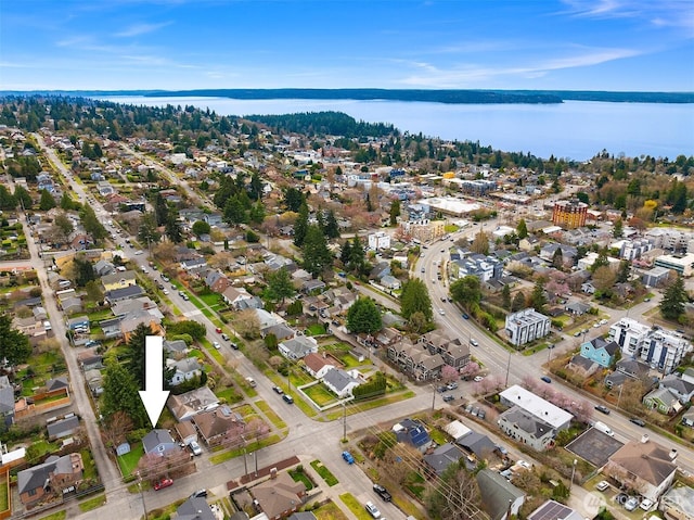 birds eye view of property with a water view