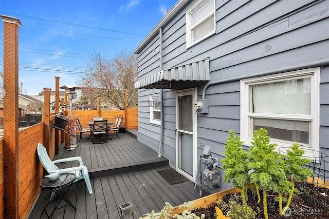 wooden terrace with outdoor dining area