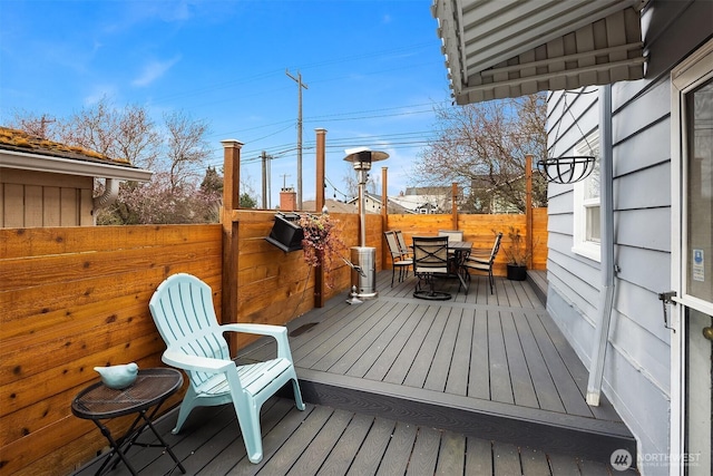 wooden deck with outdoor dining space