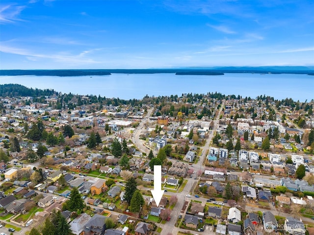 drone / aerial view with a residential view and a water view