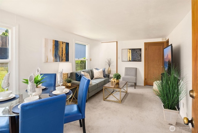 living room with carpet flooring and a healthy amount of sunlight