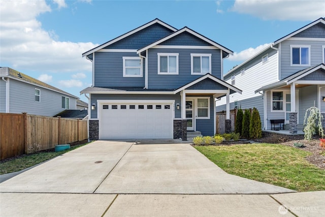 craftsman-style house featuring a garage, stone siding, fence, and concrete driveway
