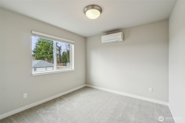 spare room with baseboards, carpet floors, and an AC wall unit