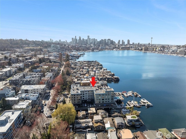 bird's eye view featuring a view of city and a water view