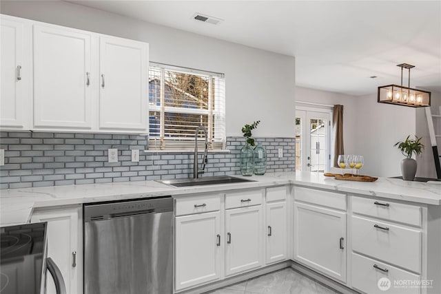 kitchen featuring a sink, visible vents, dishwasher, and white cabinetry