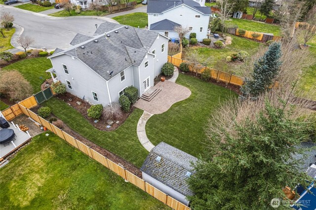 birds eye view of property with a residential view