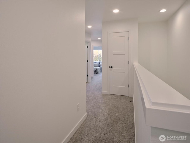 corridor with recessed lighting, baseboards, and carpet