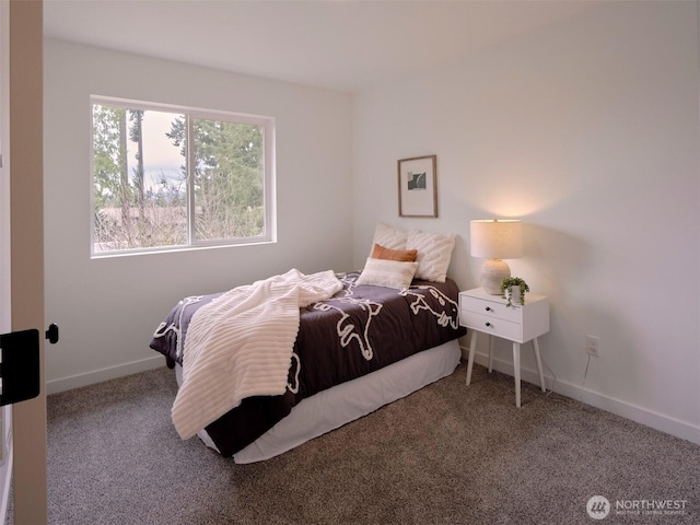 carpeted bedroom with baseboards