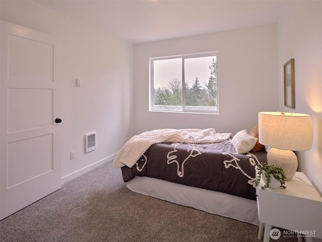 bedroom with visible vents, carpet, and baseboards