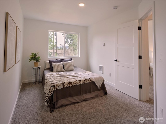 carpeted bedroom featuring baseboards