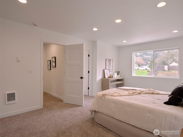 bedroom with recessed lighting, light colored carpet, visible vents, and baseboards