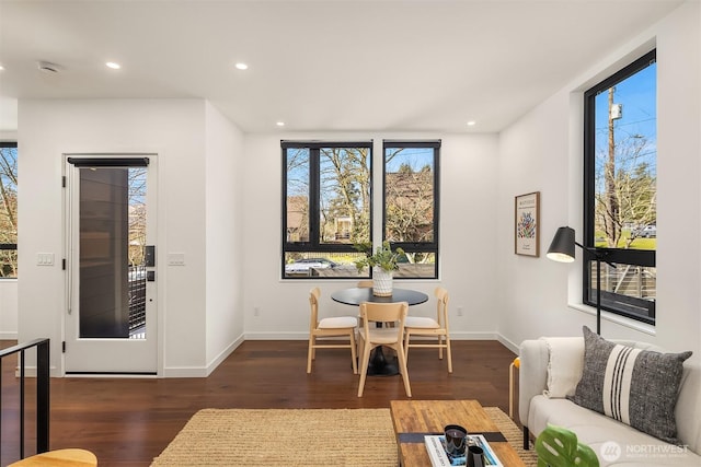 living room with recessed lighting, wood finished floors, and baseboards