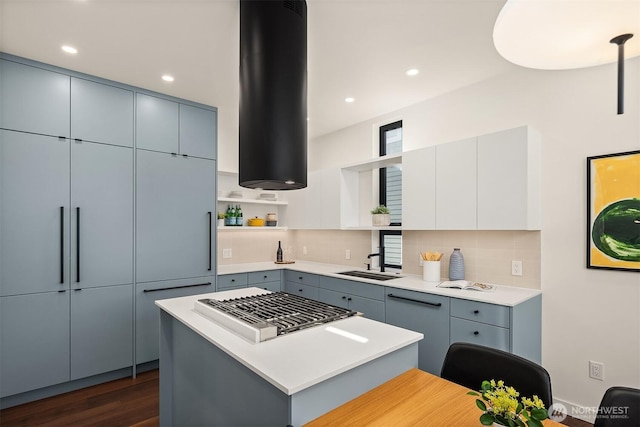 kitchen featuring open shelves and gray cabinetry