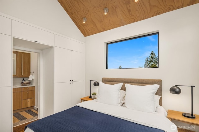 bedroom with lofted ceiling, a closet, and wooden ceiling