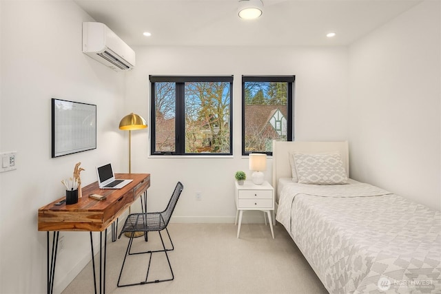 bedroom featuring an AC wall unit, recessed lighting, baseboards, and light carpet