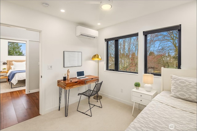 carpeted bedroom featuring a wall unit AC, multiple windows, recessed lighting, and baseboards