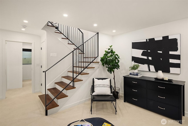 interior space with recessed lighting, stairway, light carpet, and baseboards