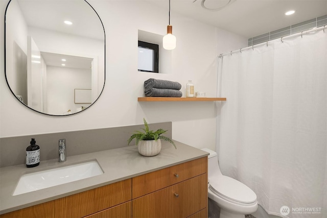 bathroom with vanity, curtained shower, toilet, and recessed lighting