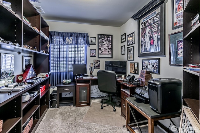 carpeted office space featuring visible vents