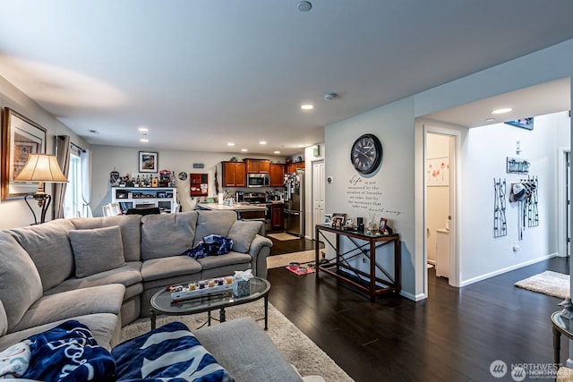 living area with recessed lighting, dark wood-style floors, and baseboards