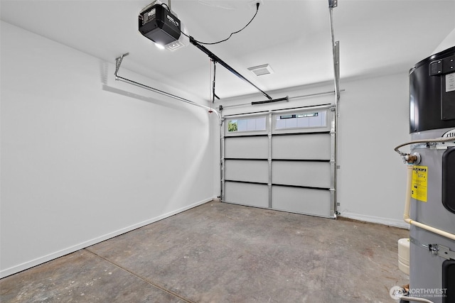 garage featuring a garage door opener and baseboards