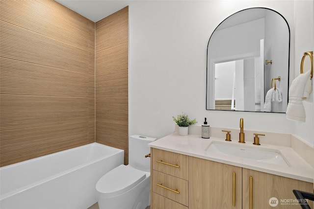 bathroom featuring toilet and vanity