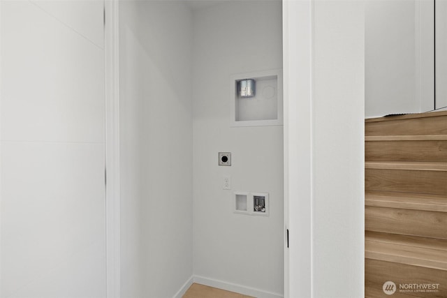 laundry room with electric dryer hookup, hookup for a washing machine, and laundry area