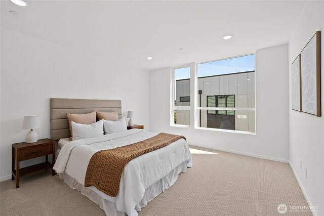 carpeted bedroom with recessed lighting and baseboards