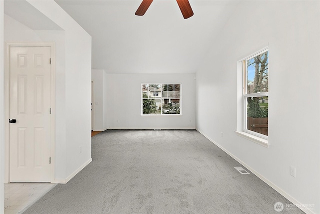 empty room with carpet flooring, baseboards, visible vents, and a ceiling fan