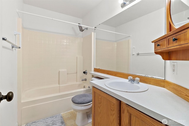 bathroom featuring vanity, toilet, and shower / washtub combination