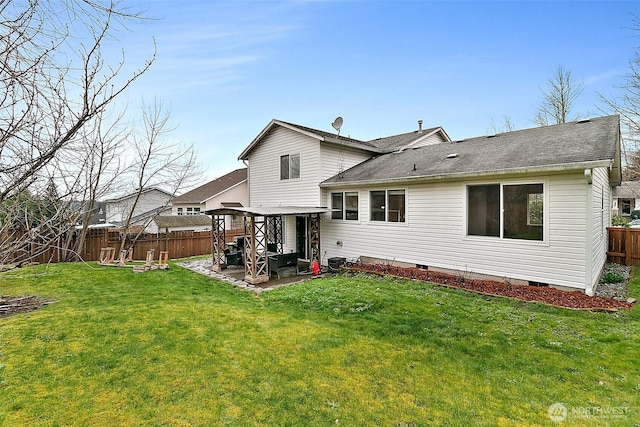 back of house with a fenced backyard, a yard, roof with shingles, crawl space, and a patio area