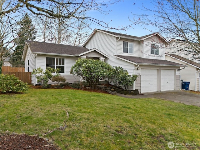 traditional home with aphalt driveway, a garage, a front lawn, and fence